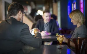 Corporate guests networking and talking at an evening reception in Central London.